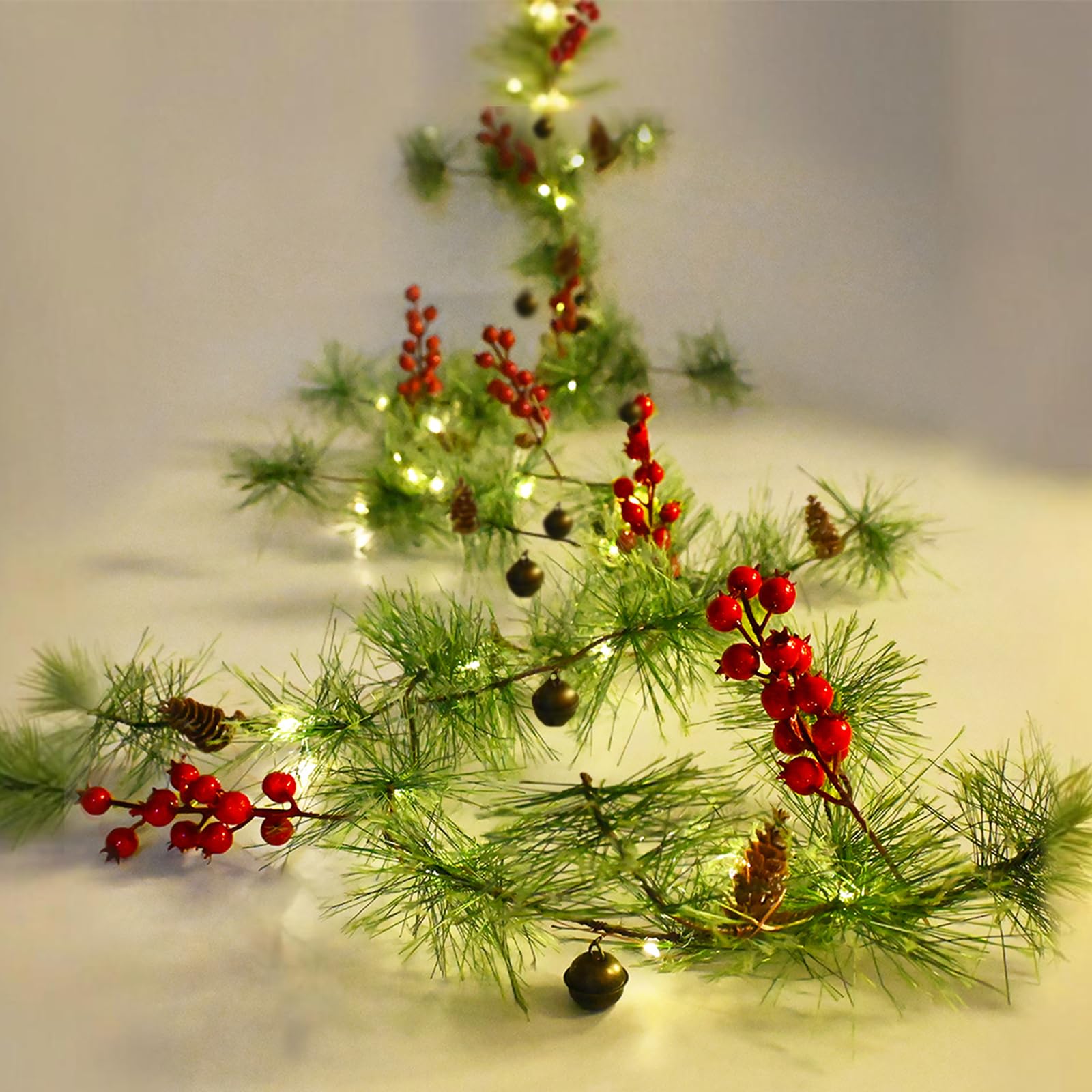 Photo 1 of Christmas Garland Lights 9.84 FT Smokey Pine Garland with 40 LED Fairy Lights Battery Operated Red Berries Bells Pine Cones Garland Wreath for Christmas Tree Door Mantle Indoor Outdoor Home Decoration