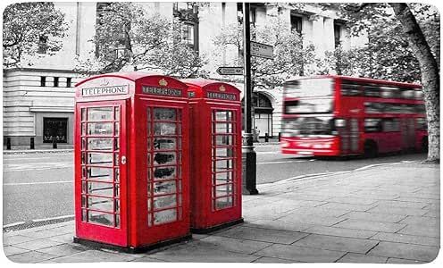Cabina telefónica roja y autobús rojo en movimiento, felpudo de Londres