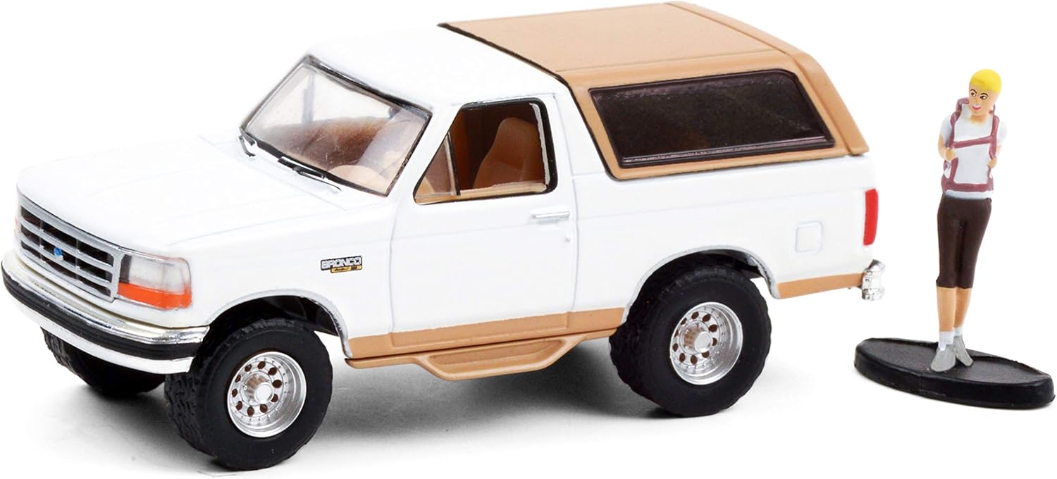 1996 Ford Bronco Eddie Bauer Oxford White and Light Saddle with Backpacker Figurine The Hobby Shop 1/64 Diecast Model Car by Greenlight 97100 F: Toys & Games
