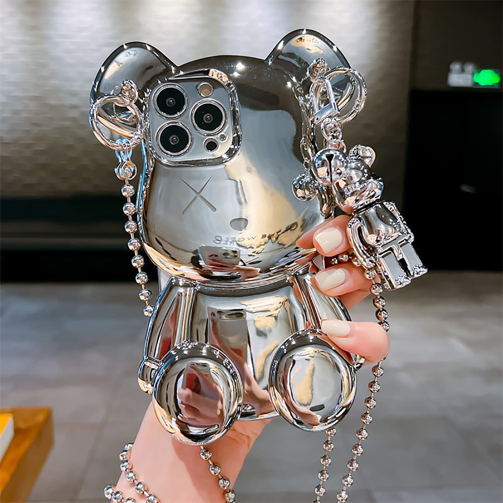 Photo 1 of LANJINDENG Compatible with iPhone 15 Pro Max Case Cute 3D Cartoon Teddy Bear Luxury Designer for Women Girls with Silver Metal Chain Strap Bell Pendant Sparkle Bling Street Fashion Protection Cover