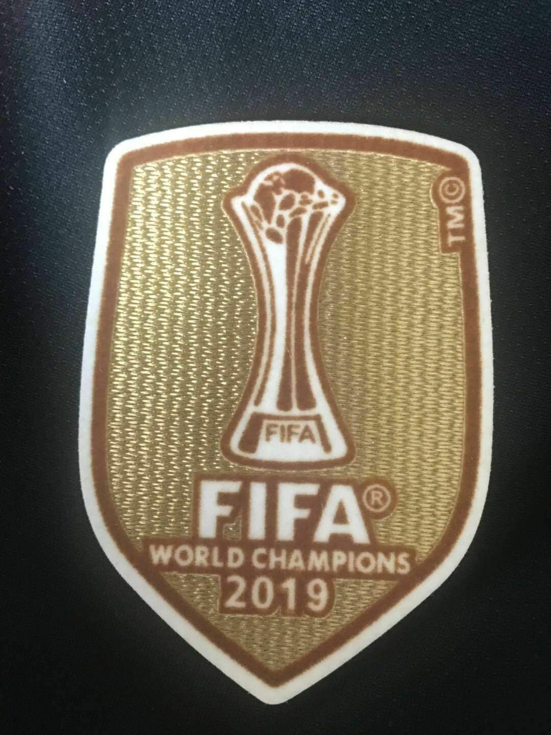 liverpool shirt with gold badge