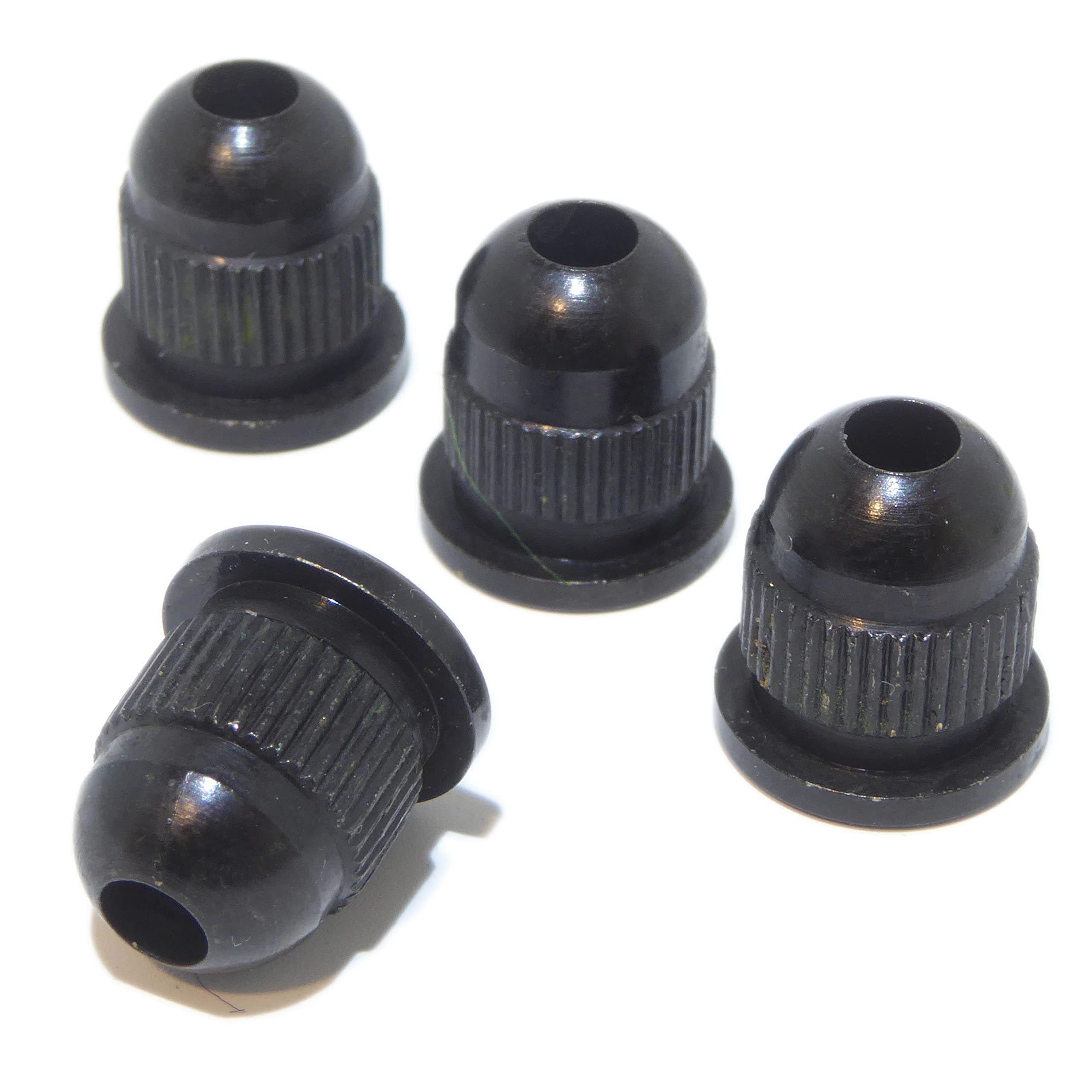 Four bass guitar string ferrules in black finish