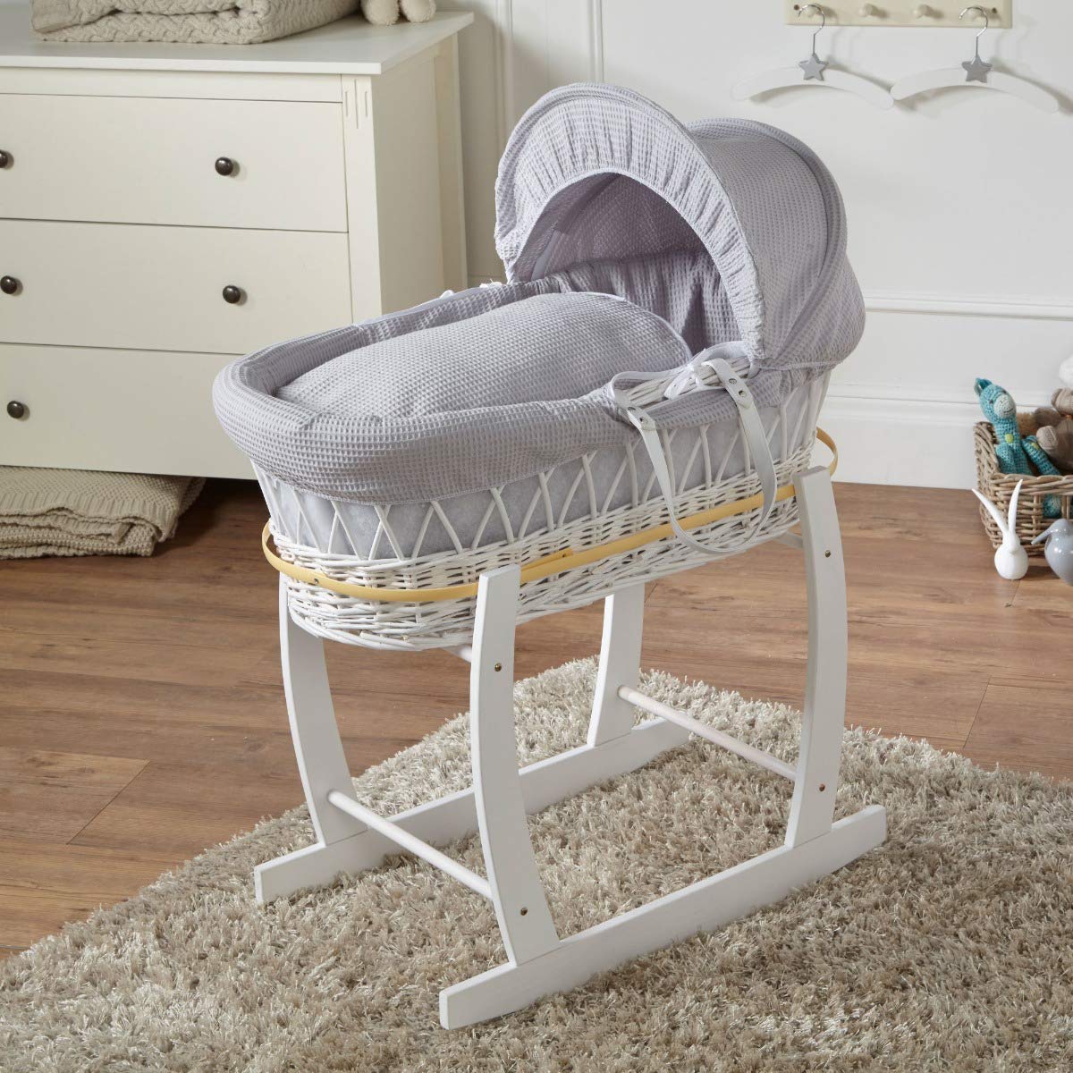 grey and white moses basket and stand