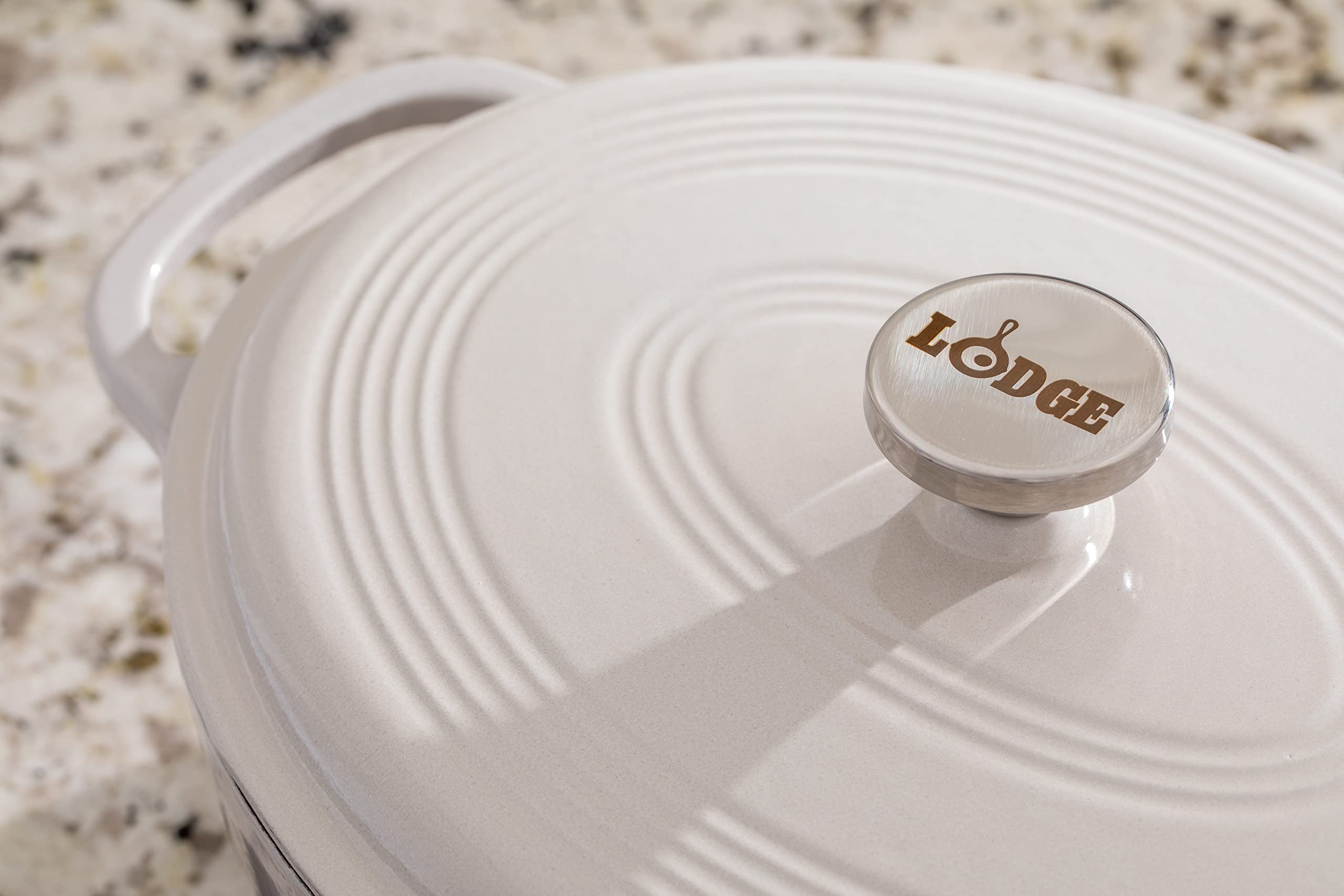 Lodge 7 Quart Enameled Cast Iron Oval Dutch Oven with Lid – Dual Handles – Oven Safe up to 500° F or on Stovetop - Use to Marinate, Cook, Bake, Refrigerate and Serve – Oyster White