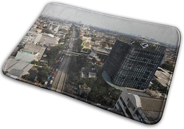 Fotografía aérea del vehículo que pasa entre edificios, alfombra de