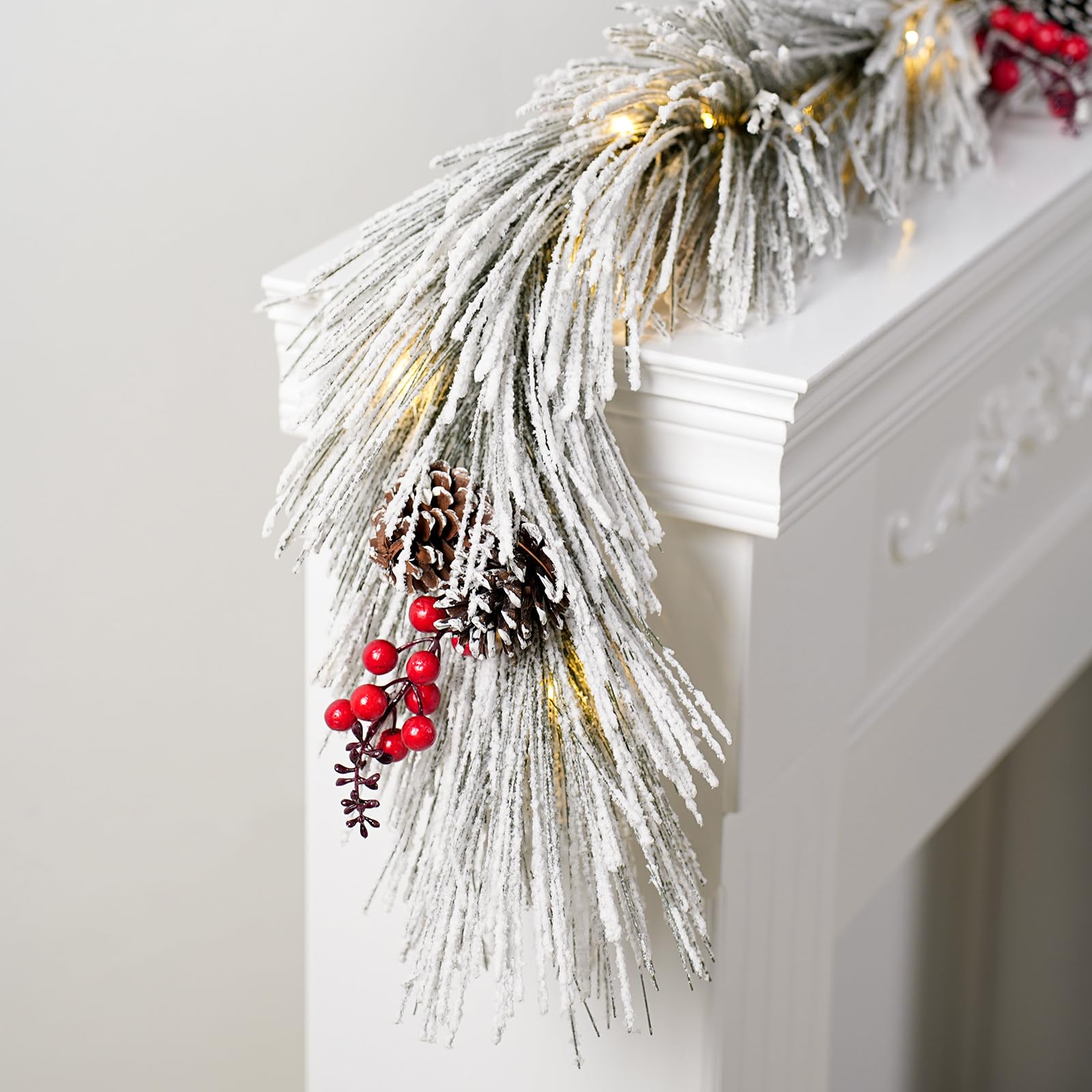 Photo 1 of HIAGROW Christmas Garland with Lights, 6FT Artificial White Snowflake Garland Decorations with Red Berries Pine Cones, Lighted Christmas Garland for Home Winter Fireplace Door Stairs Decorations