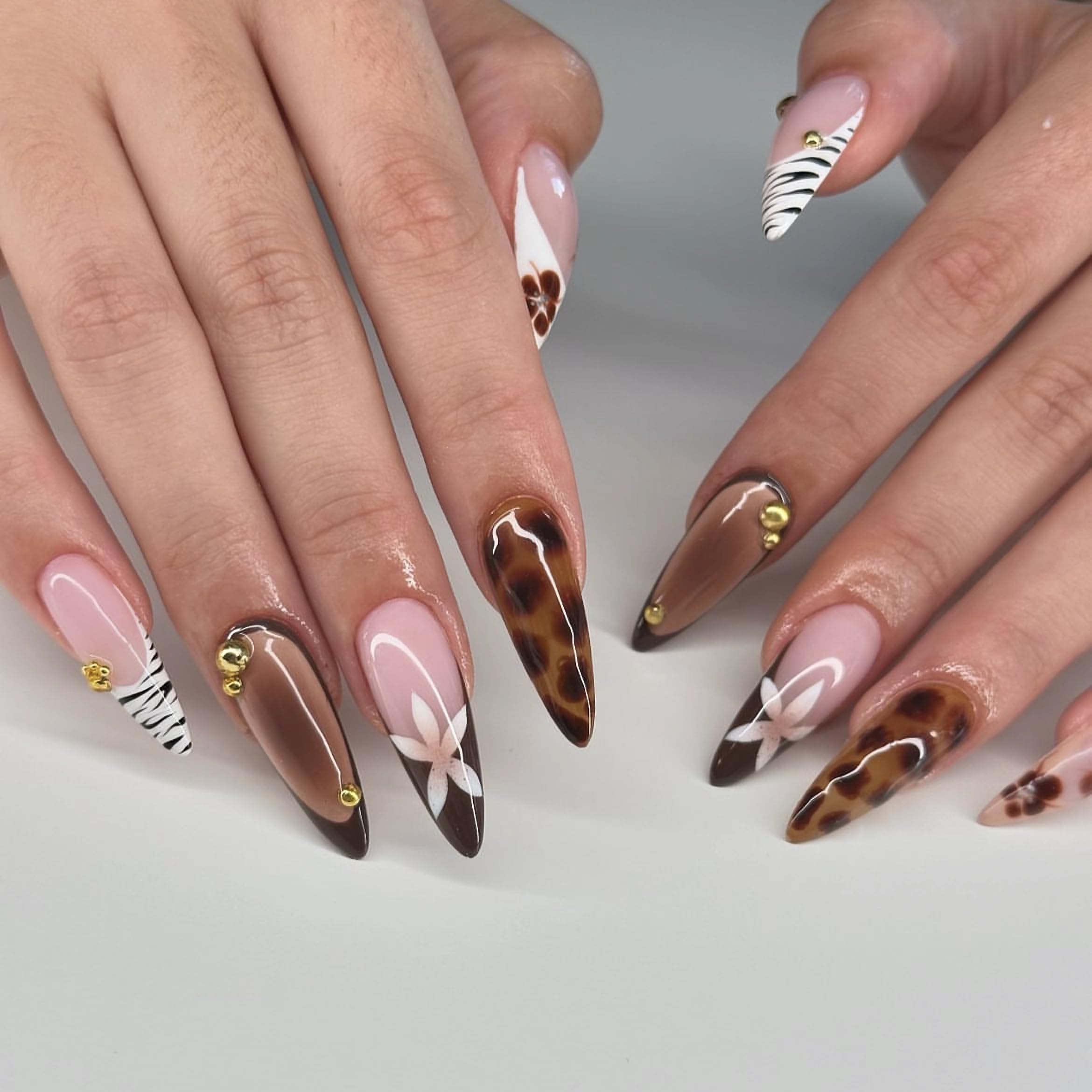 MERVF Almond Press on Nails Long Fall Fake Nails Brown French Tip Glue on Nails Flower Stiletto Acrylic False Nails Aura Press ons with Zebra Print Design Glossy 24pcs