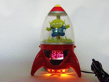 Amazon トイストーリー エイリアン 光る オレンジ色ムードランプ付き Ufoキャッチャー ロケット形 目覚まし時計 おもちゃ おもちゃ