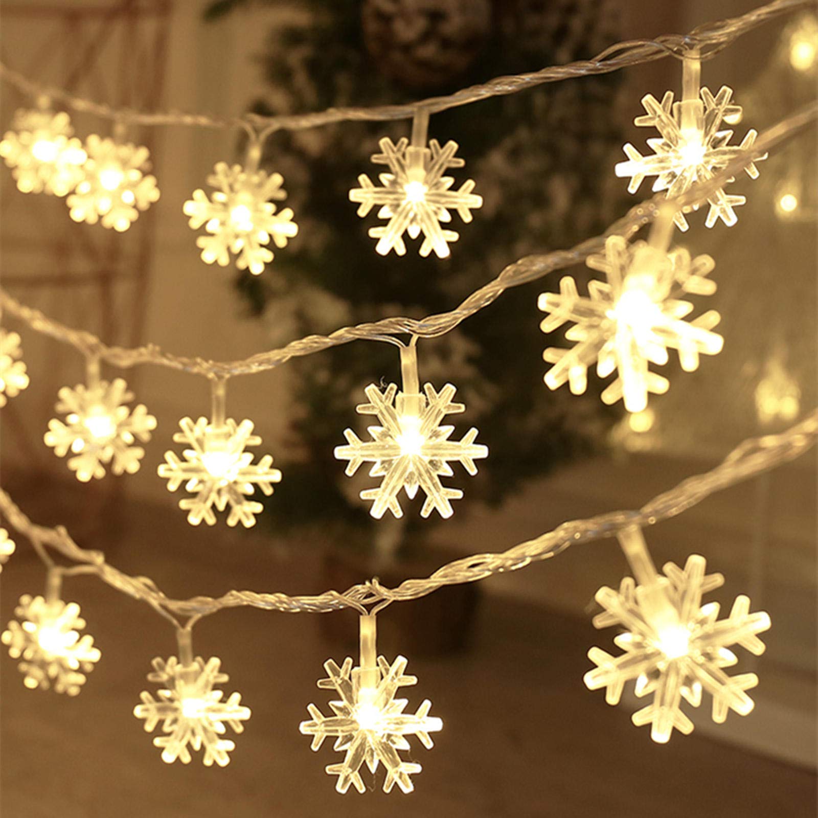 Photo 1 of CESOF Christmas Decorations Lights, 20 Ft 40 LED Snowflake String Lights Battery Operated Fairy Lights for Bedroom Room Party Home Office Xmas Decor Indoor Outdoor Tree Decorations Warm White