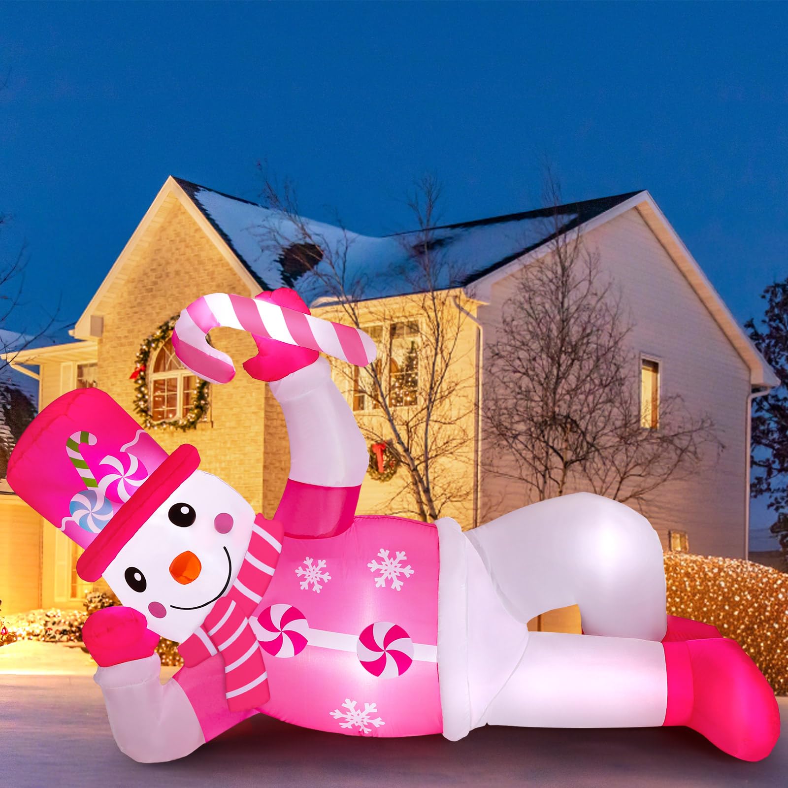 Photo 1 of Jenaai 6 FT Christmas Inflatables Snowman Outdoor Decorations Blow Up Yard Snowman Inflatable with LED Lights for Xmas Holiday Party Patio Garden Lawn(Pink,Lying)