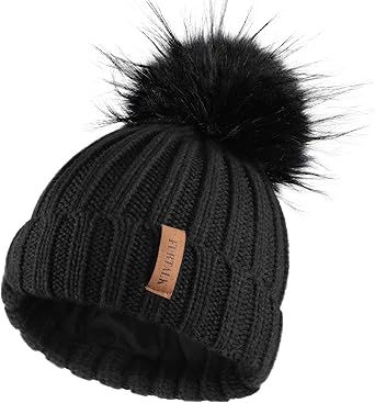 black leather hat with fur ball on top