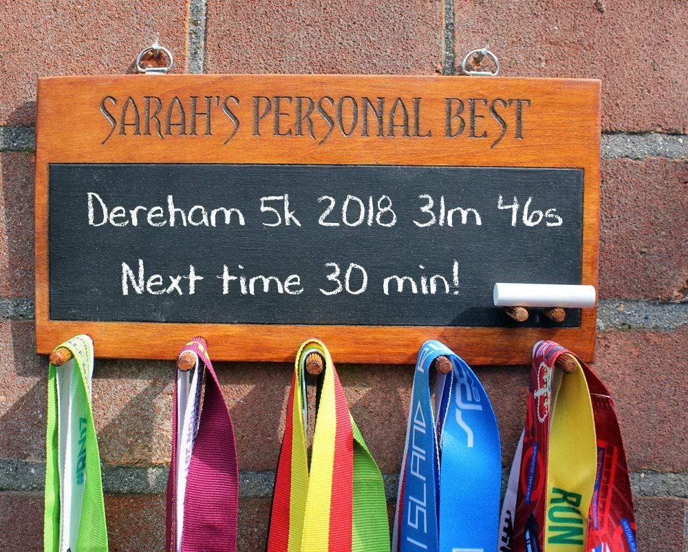 A personalised wooden medal holder with chalk board. A wooden custom