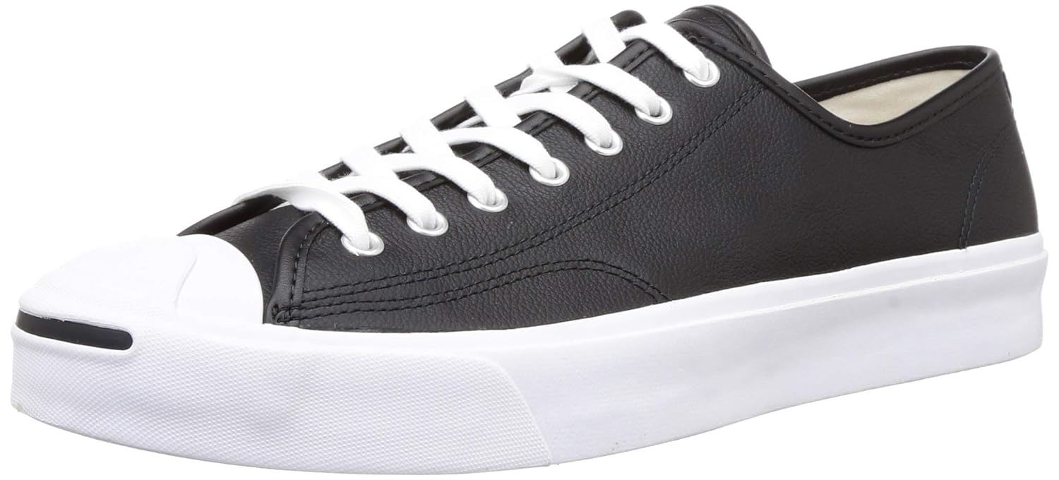 white converse with black writing