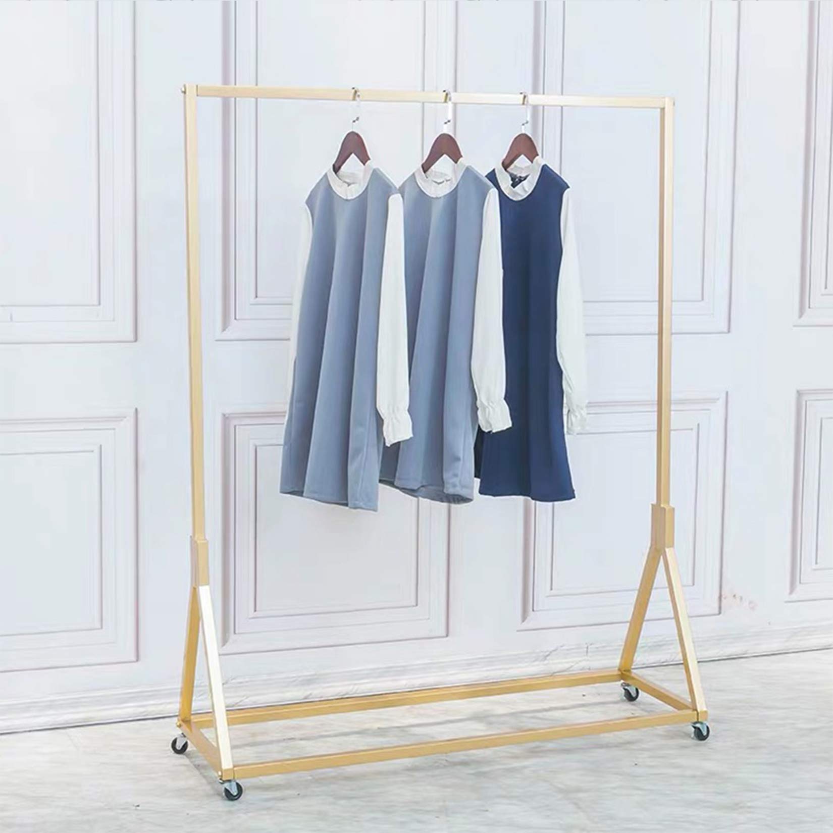 Photo 1 of FURVOKIA Modern Simple Heavy Duty Metal Rolling Garment Rack with Wheel,Retail Display Clothing Rack, Single Rod Floor-Standing Hangers Clothes Shelves (Gold Square Tube A, 47.2 L)