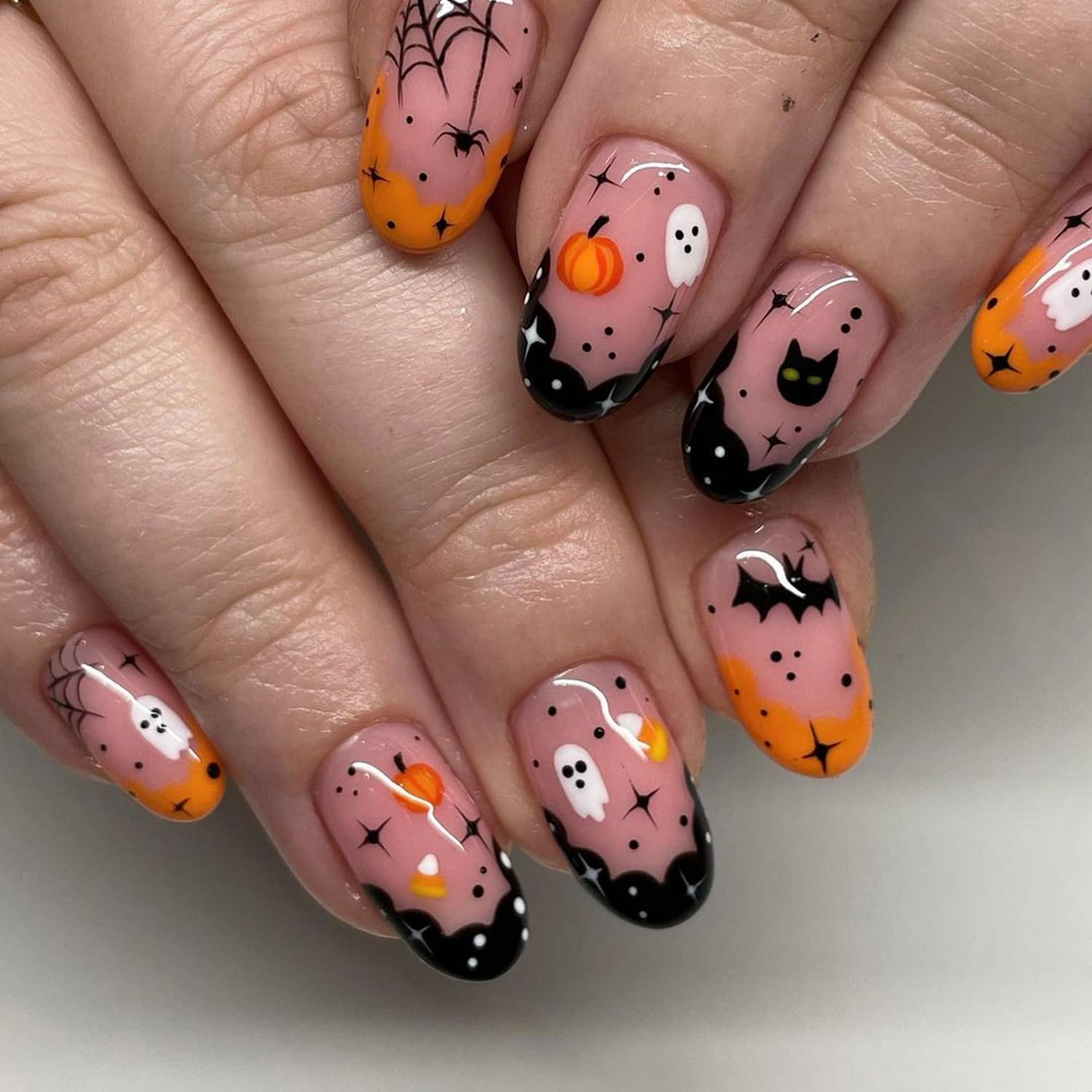 Photo 1 of 24pcs Cute Halloween Press on Nails Short Almond Fake Nails Nude False Nails with Ghost Cat Bat Pumpkin Designs Halloween Glossy Artificial Acrylic Nails Full Cover Glue on Nails for Women Manicure