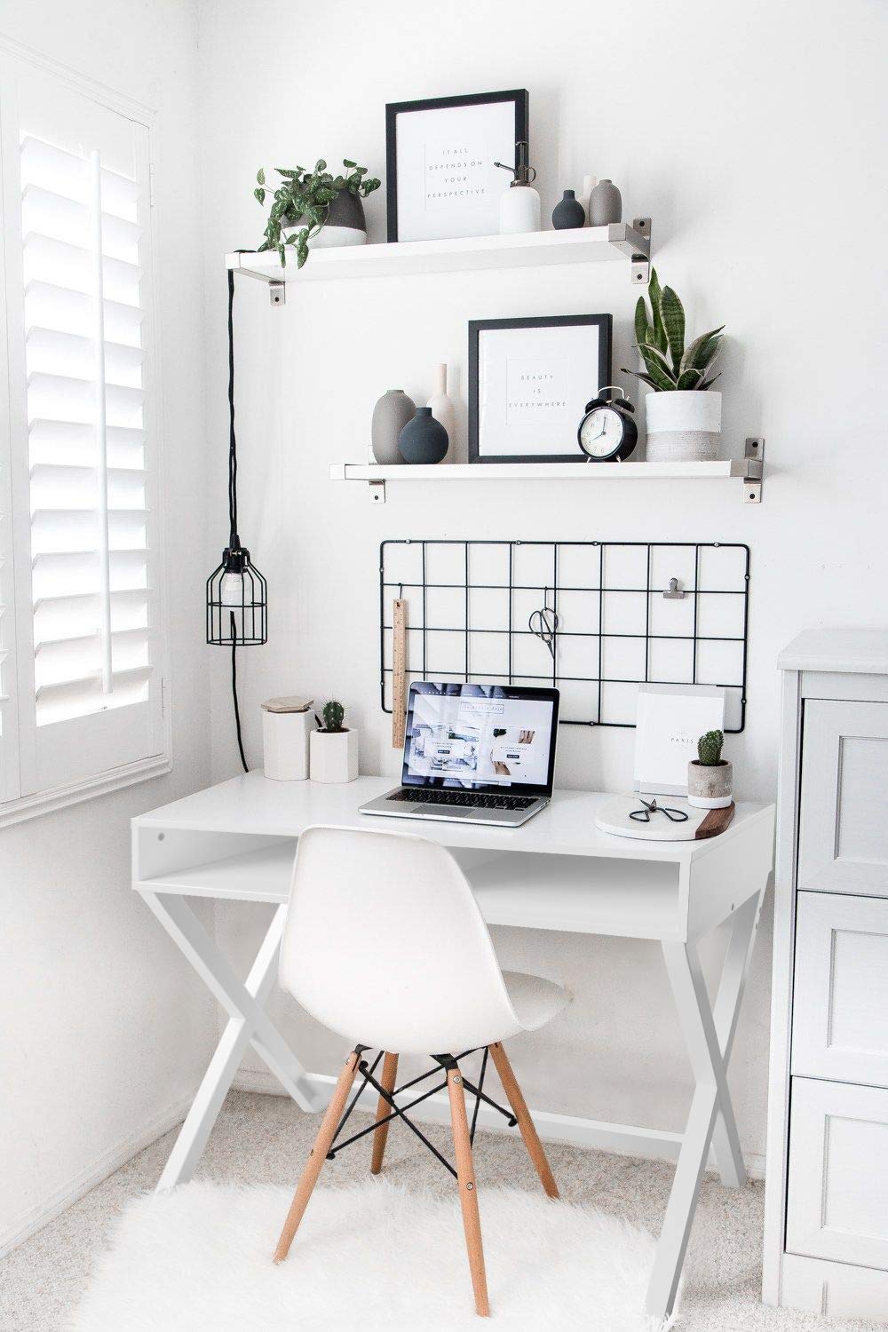 A Chic Home Office With A Large Desk, Ergonomic Chair, And Built-in
