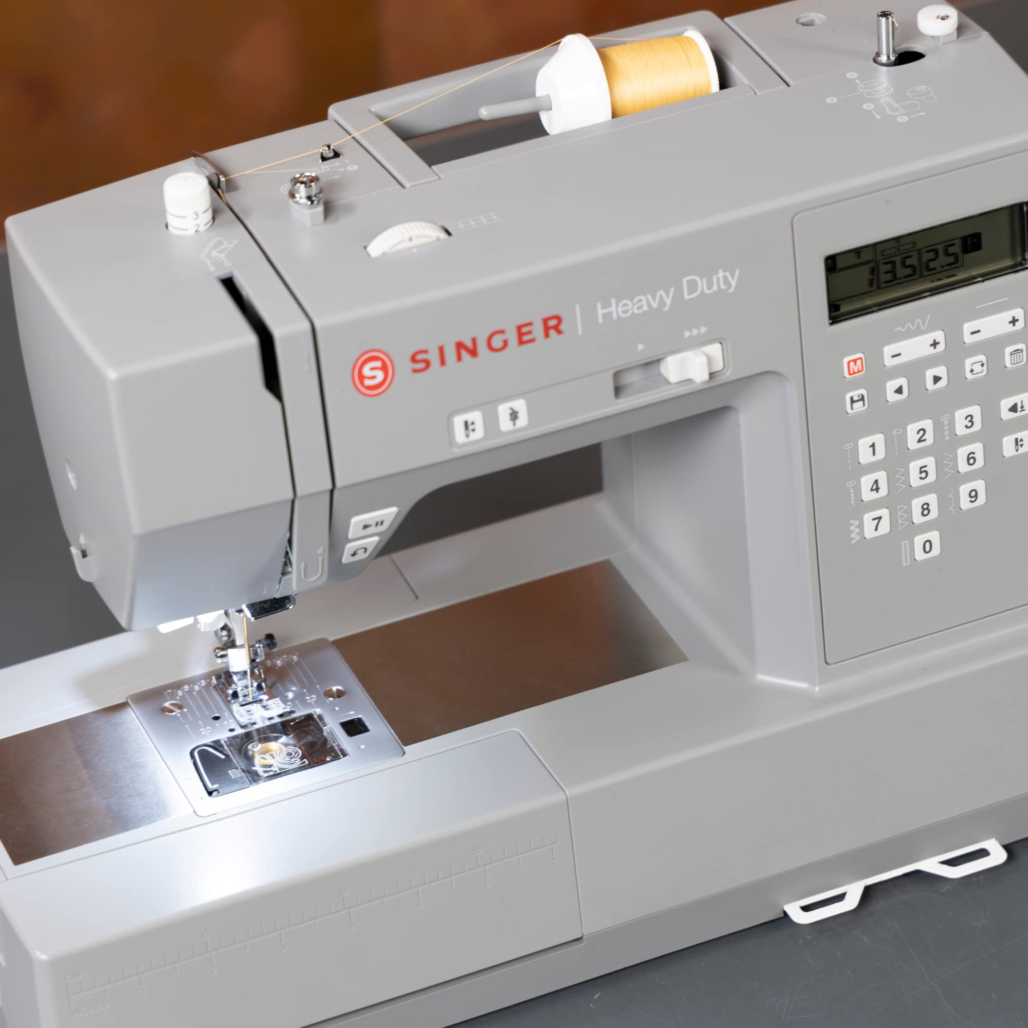 SINGER Heavy Duty 6700C Computerized Sewing Machine with Accessory Kit | Strong Motor with Enhanced Piercing Power, 411 Stitch Applications, LCD Screen, Full Metal frame & 1-step Buttonhole