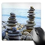 Three Zen Stone towers on pebble beach - harmony