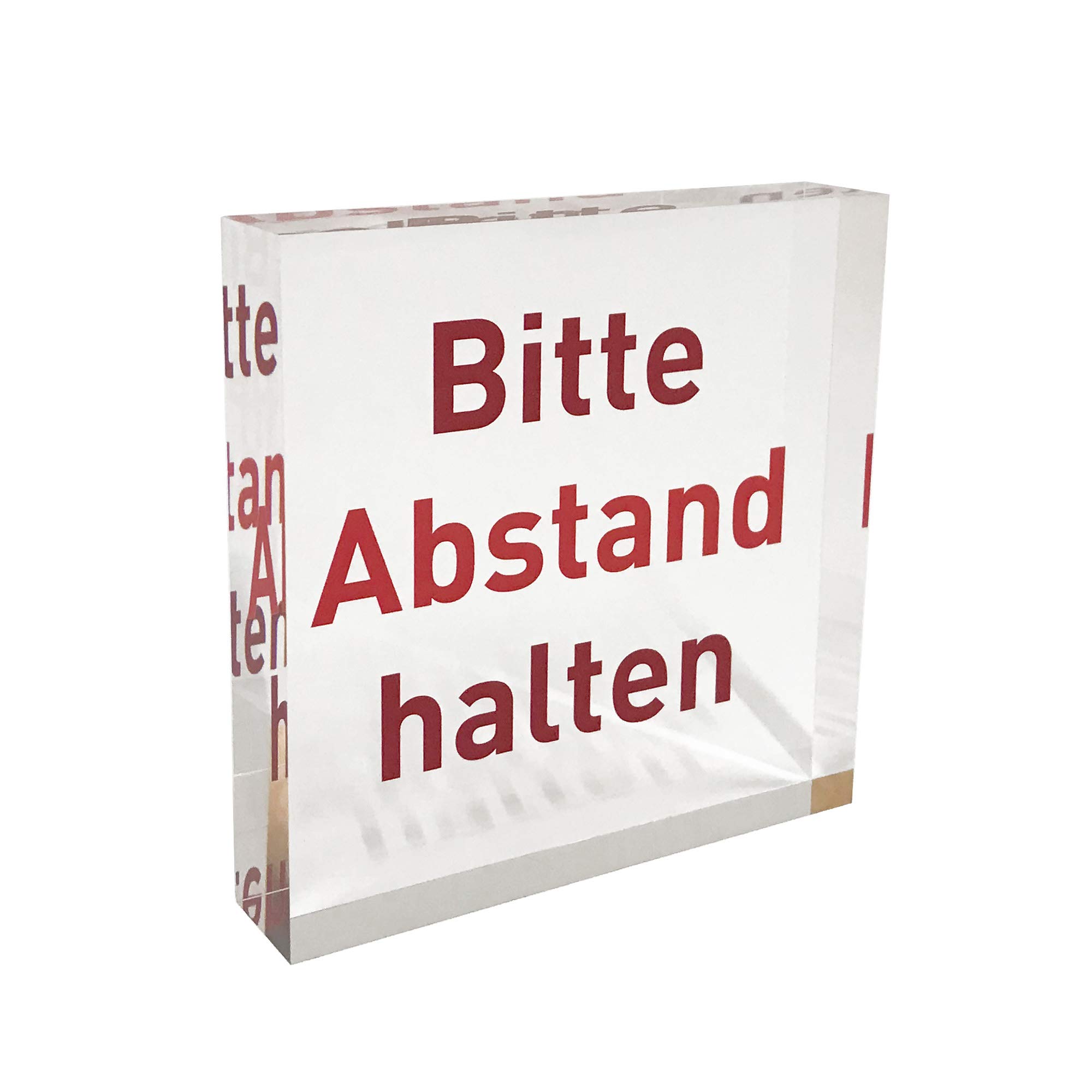 Plexiglas® block as a crystal clear information stand/information stand with red note print "Bitte Abstand halten".