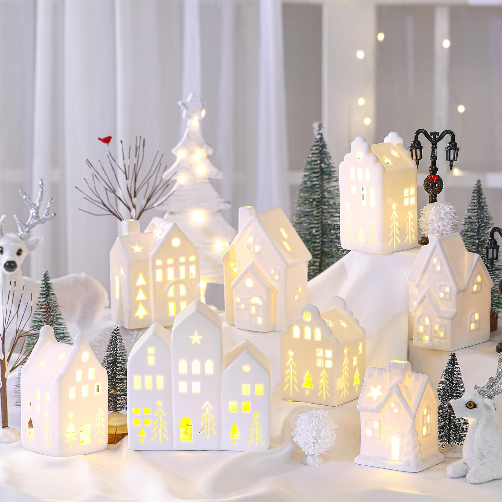 Photo 1 of Cindeer 26 Pcs Ceramic Christmas Village Set 8 LED Christmas Village Houses 16 Xmas Trees Farmhouse 2 Lamp Post Scenes Decor White Tabletop Decoration(Elegant)