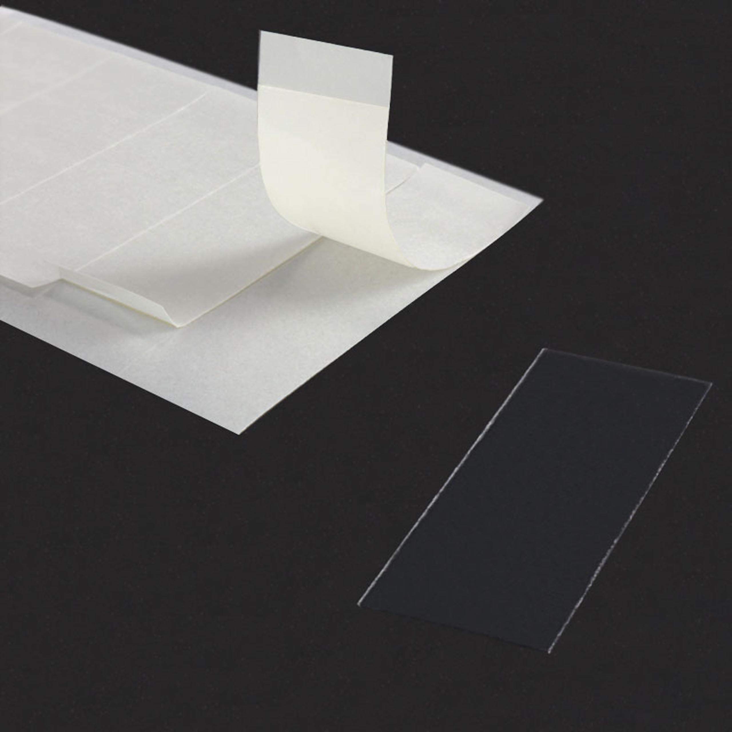 Double-sided mounting adhesive strips, transparent