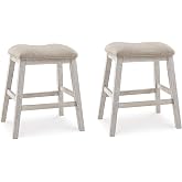 Signature Design by Ashley Skempton Counter Height Bar Stool, Set of 2 | Space-saving 24-inch farmhouse design, Supportive 18.5-inch foam-cushioned saddle seat, Distressed wood frame with footrest