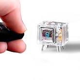 TinyCircuits TinyTV&reg; Mini &ndash; Ultra-Mini Classic TV, Preloaded &amp; Uploadable Videos, USB-C Rechargeable, 0.6&Prime; OLED Display (Clear)
