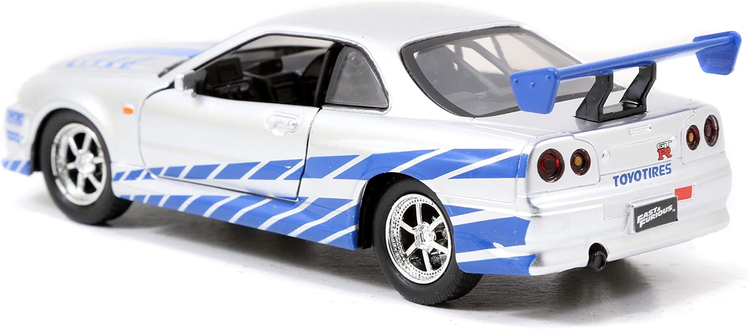 Amazon Com Jada Toys Fast Furious 1 32 Brian S Nissan Skyline Gt R R34 Die Cast Car Silver Blue Toys For Kids And Adults Toys Games