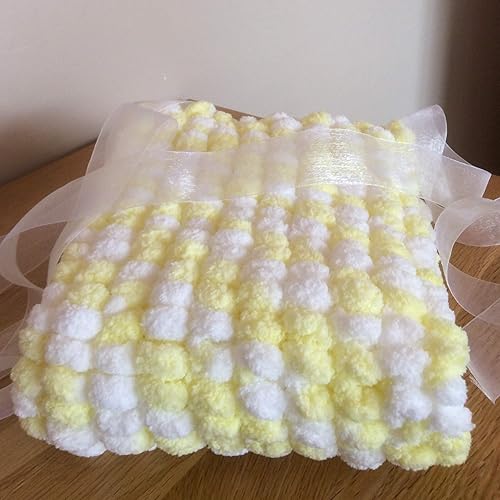 pom pom knitted baby blanket