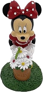 Disney Minnie Mouse is Smelling her Flowers and sees a Bright Green Caterpillar. Minnie Welcomes You to The Garden with Bright Spring Colors. Stands 8 Inches Tall and 5 Inches Wide