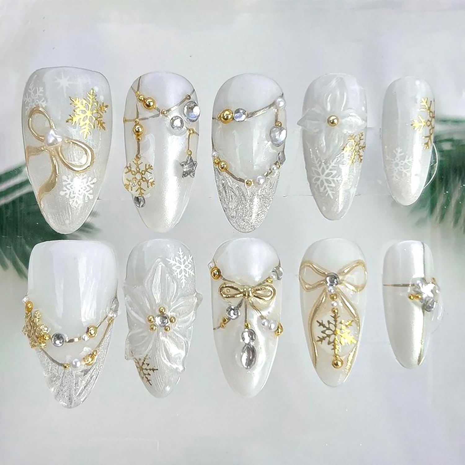 Photo 1 of 10Pcs Christmas Handmade Press on Nails Medium Almond Fake Nails White Flower False Nails with Gold Bow Snowflake Rhinestones Design Full Cover Artificial Glue on Nails Winter Stick on Nail for Women