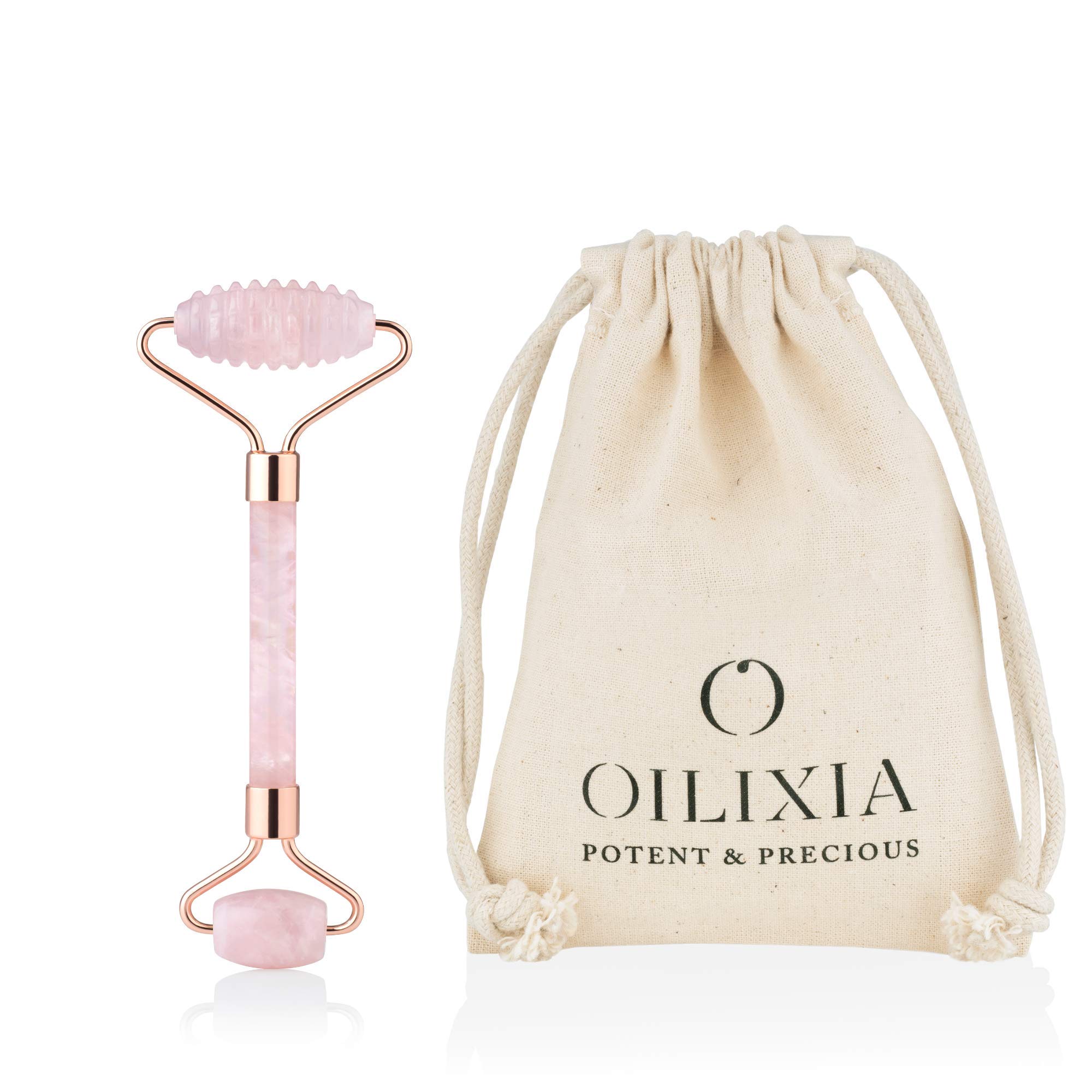 Rose quartz face roller with rose gold metal, featuring a bumpy roller and small eye roller. Double ended roller for the face.