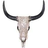 26-Inch White Resin Cow Skull Wall Decor with Longhorns and Ganesha Relief | Approx. 22.44 in L x 6.69 in D x 25.98 in H; white resin cow skull with Ganesha relief for neutral, rustic, and boho walls.