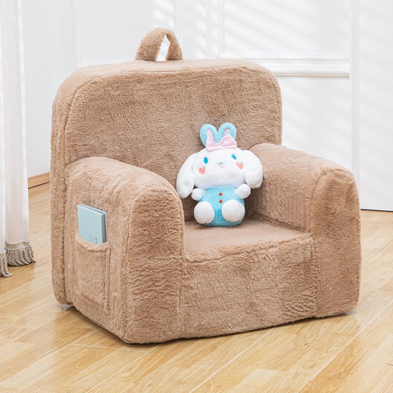 Photo 1 of SUFUS Snuggly-Soft Cuddly Toddler Plush Armchair for Boys and Girls Fuzzy Plush Kids Sofa Couch Reading Chair with Children Friendly Handle for Easy Movement & Double Pockets for Good Storage, Camel