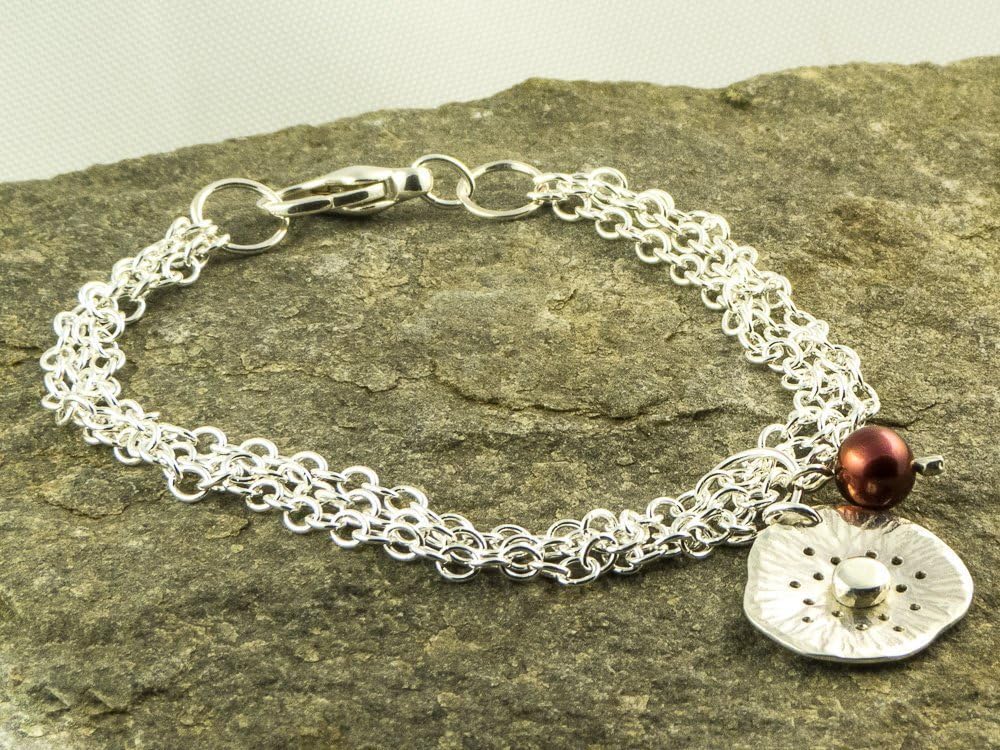 silver poppy flower charm bracelet with red freshwater pearl