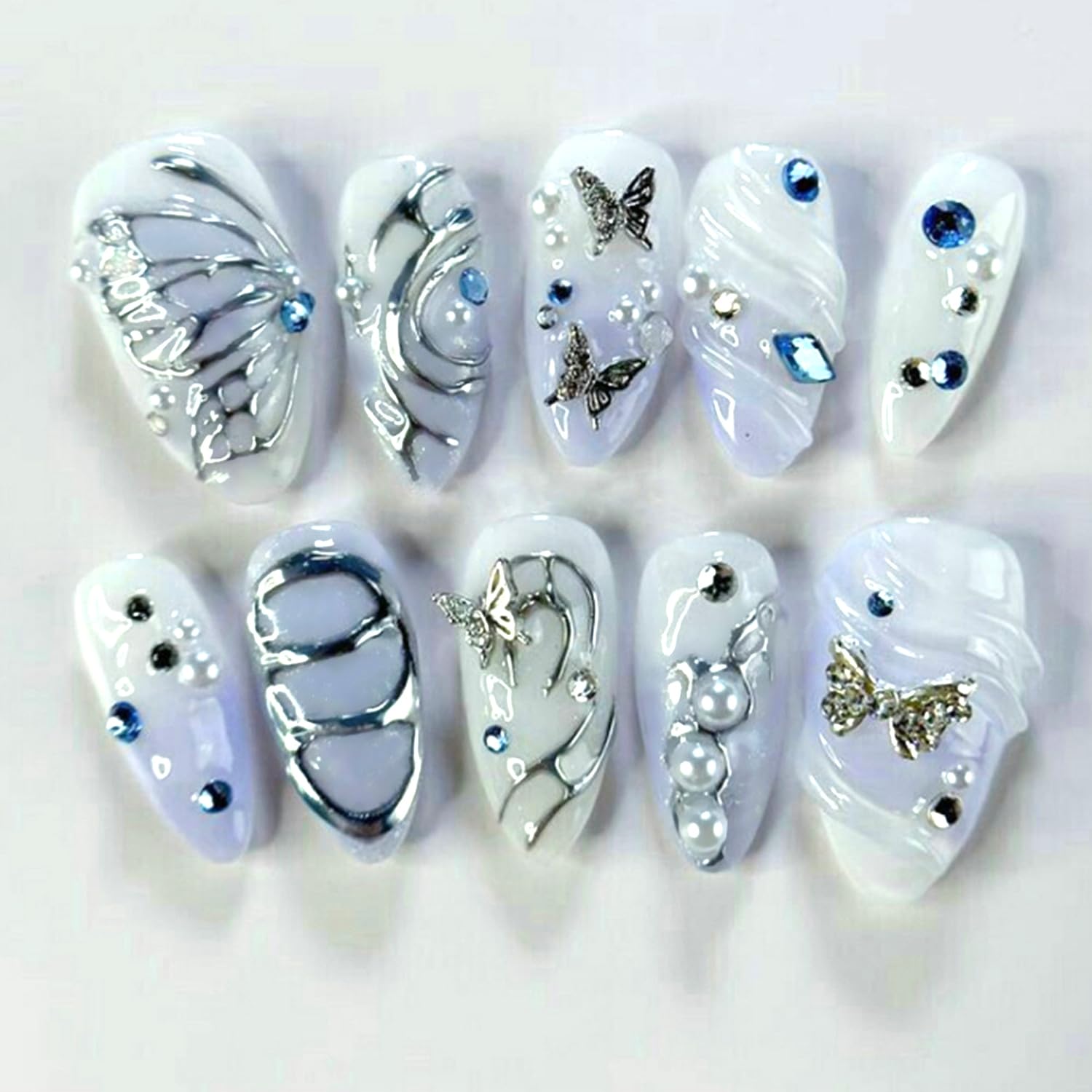 Photo 1 of 24Pcs Y2k Almond Press on Nails Mid-length Fake Nails Press on 3D Butterfly Bow Design Shiny Silver Irregular False Nails 3D Rhinestone Pearls Charms Designs Full Cover Nails Tip for Women Nails Decor