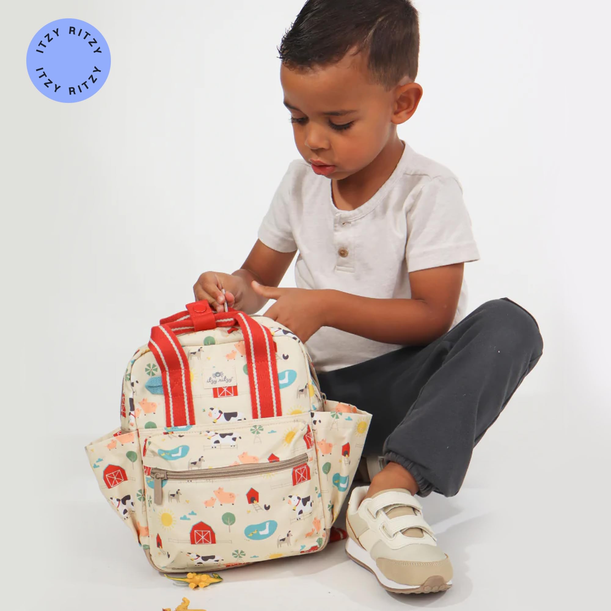 Itzy Ritzy Toddler Backpack - Daycare Bag - Features Adjustable Shoulder Straps, 2 Side Pockets & Spacious Interior with Wipeable Fabric Lining & Name Label, Farm Backpack