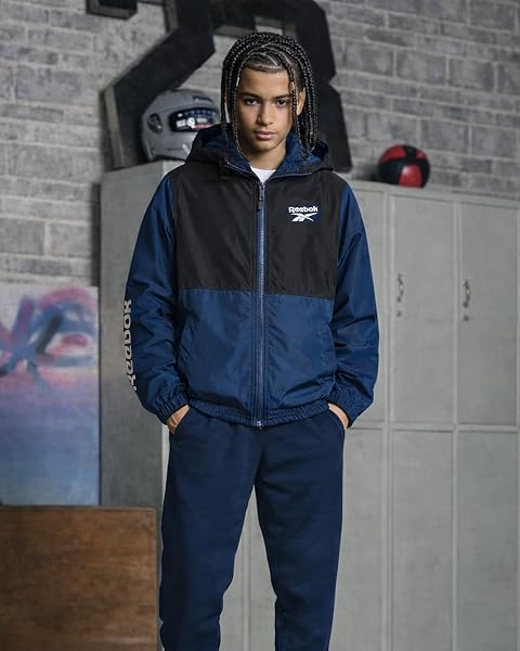 REEBOK BOYS WINDBREAKER JACKET – LIGHTWEIGHT POLAR FLEECE LINED WATER AND WIND RESISTANT HOODED ZIP UP JACKET FOR BOYS, SIZE 14-16, BATIK BLUE