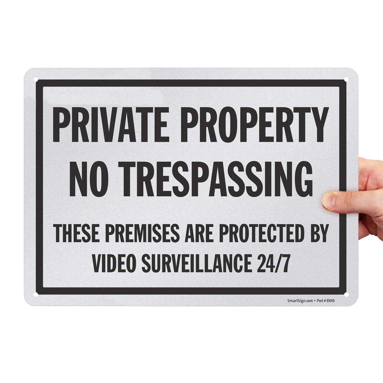 View 1 of SmartSign 10" x 14" 'Private Property No Trespassing These Premises Protected By Video Surveillance 24/7' Metal Sign, 40 mil Aluminum, Engineer Grade Reflective, Black and White, USA-Made