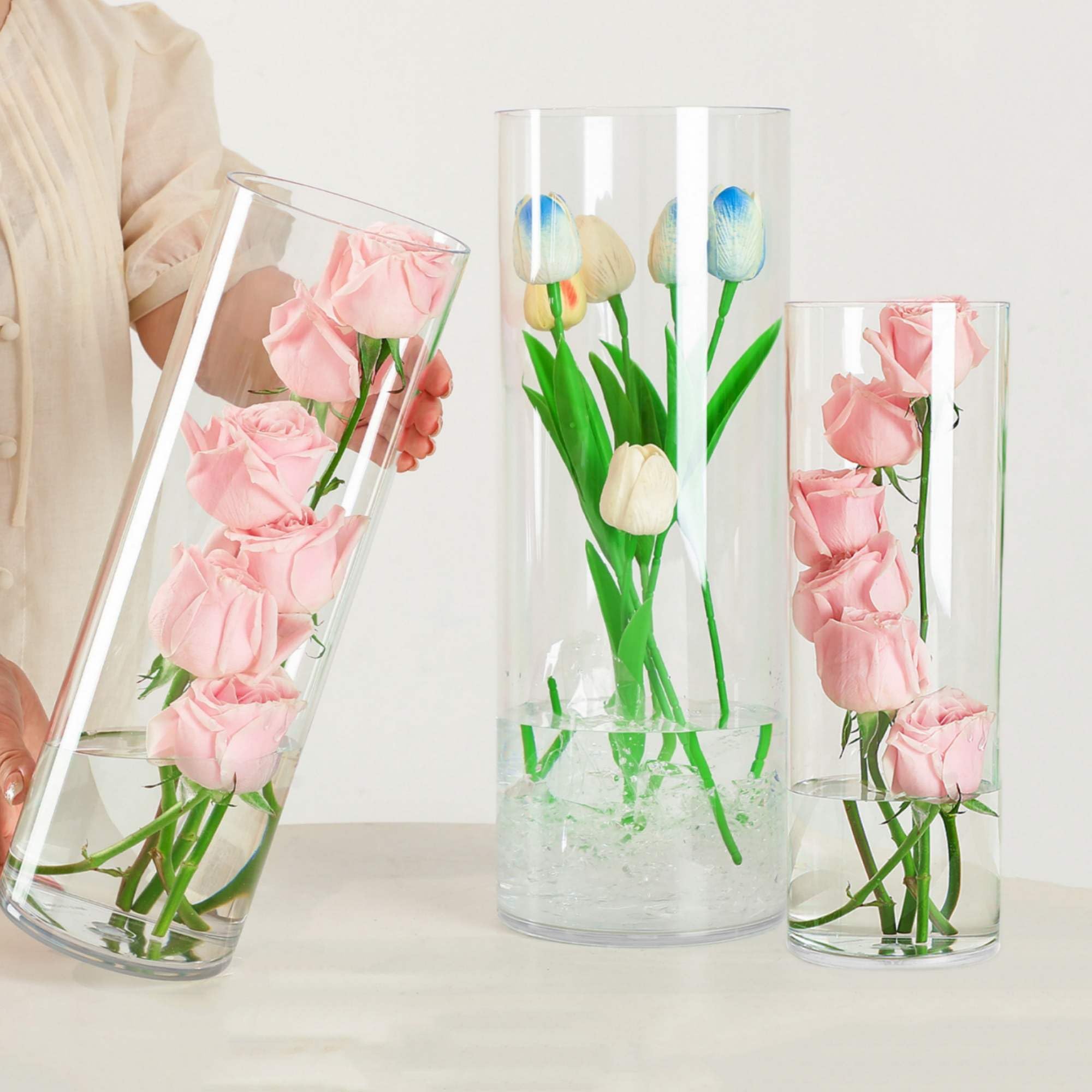 Photo 1 of Liotww Acrylic Cylinder Clear Vases, Tall Large Plastic Flower Vase for Bouquet, Unbreakable Hurricane Vases Set of 3 for Centerpieces (D 6", D 4.8", D 4" + 3 Holder)