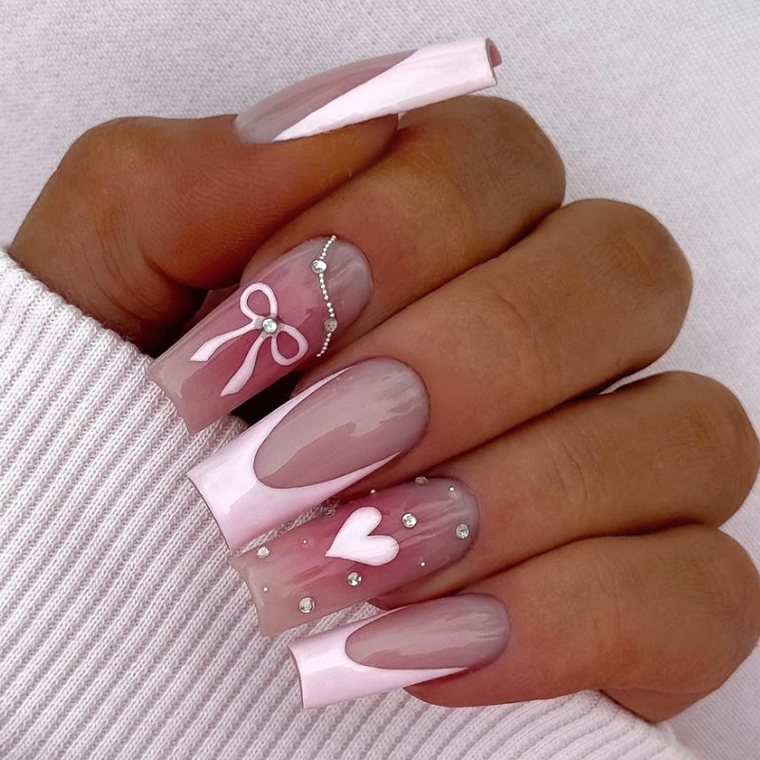 Photo 1 of 24Pcs Valentines Press on Nails Medium Square Pink French Tip Fake Nails with 3D Rhinestone Chains Designs Blush False Nails Cute Bow Heart Full Cover Nude Glossy Artificial Glue on Nails for Women