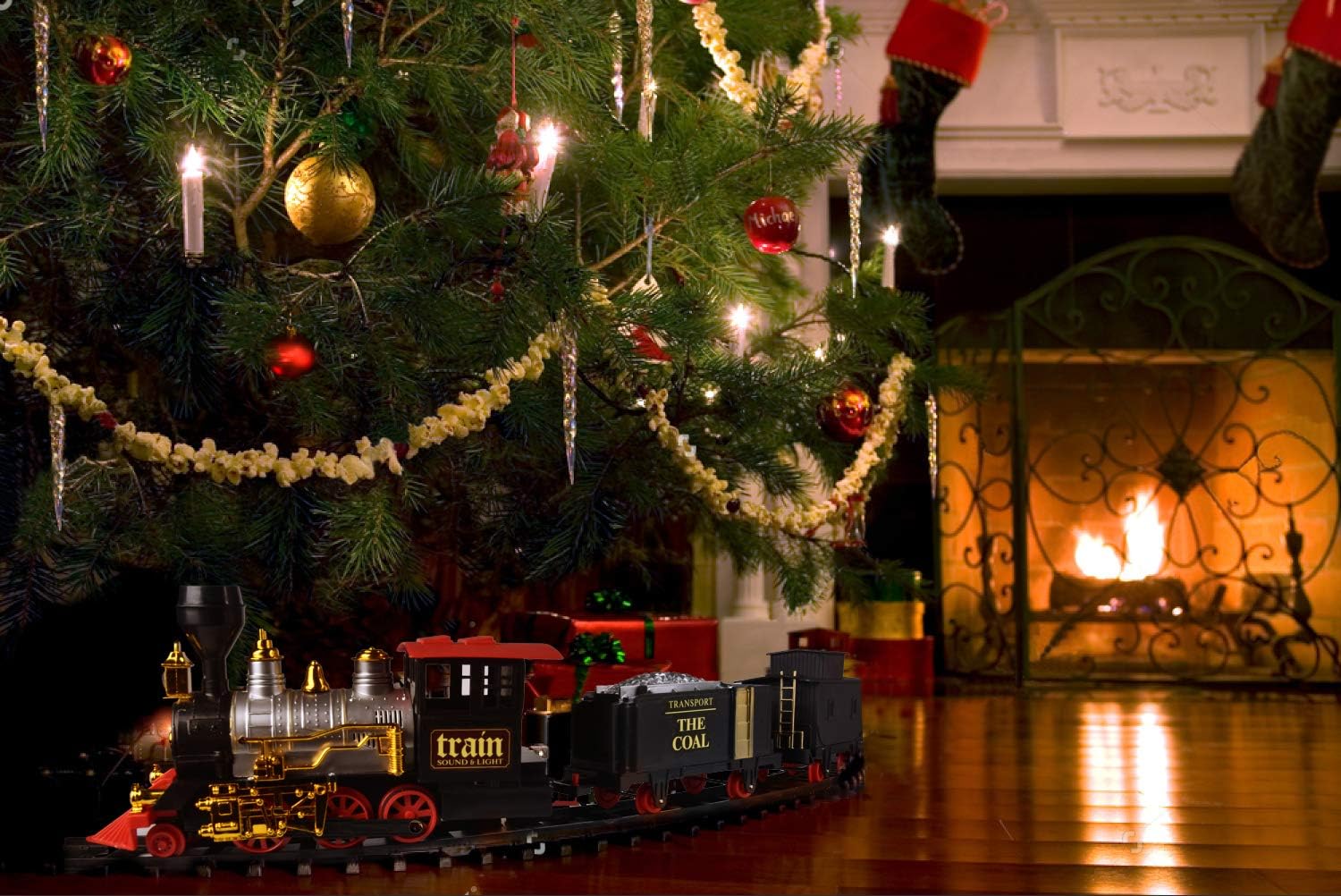 toy train set around christmas tree