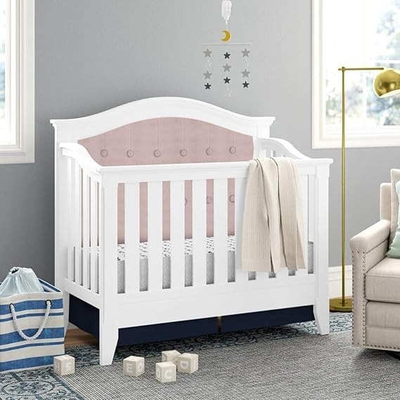pink tufted crib
