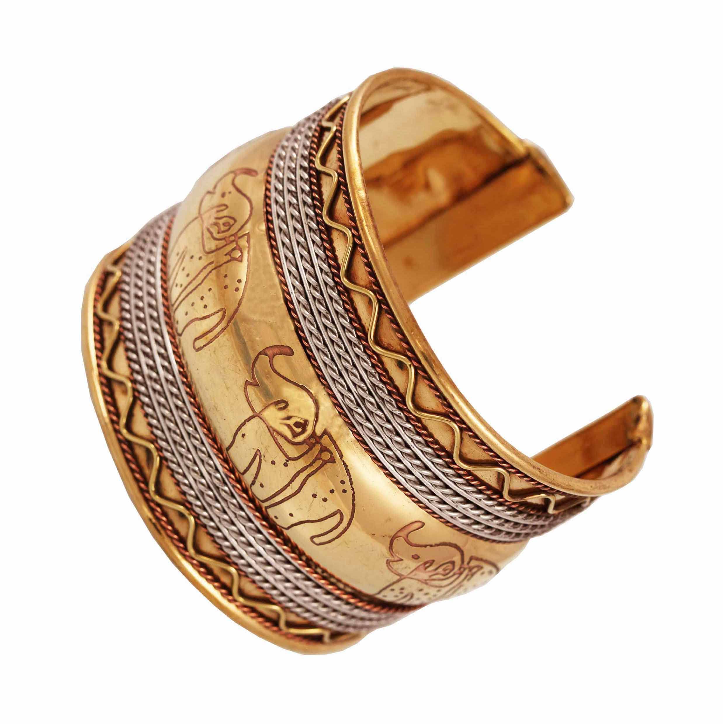 Touchstone Indian Bollywood Desire Brass Base Stylishly Handcrafted Hammered Embossed Elephant Motif Thick Wrist Enhancer Designer Jewelry Cuff Bracelet in Gold Tone for Women