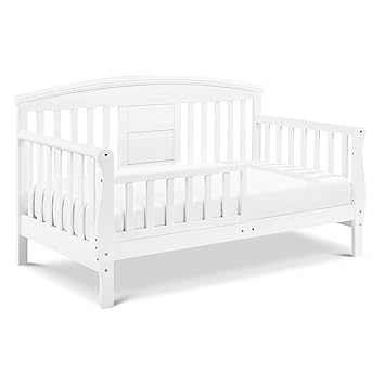 white wooden toddler bed