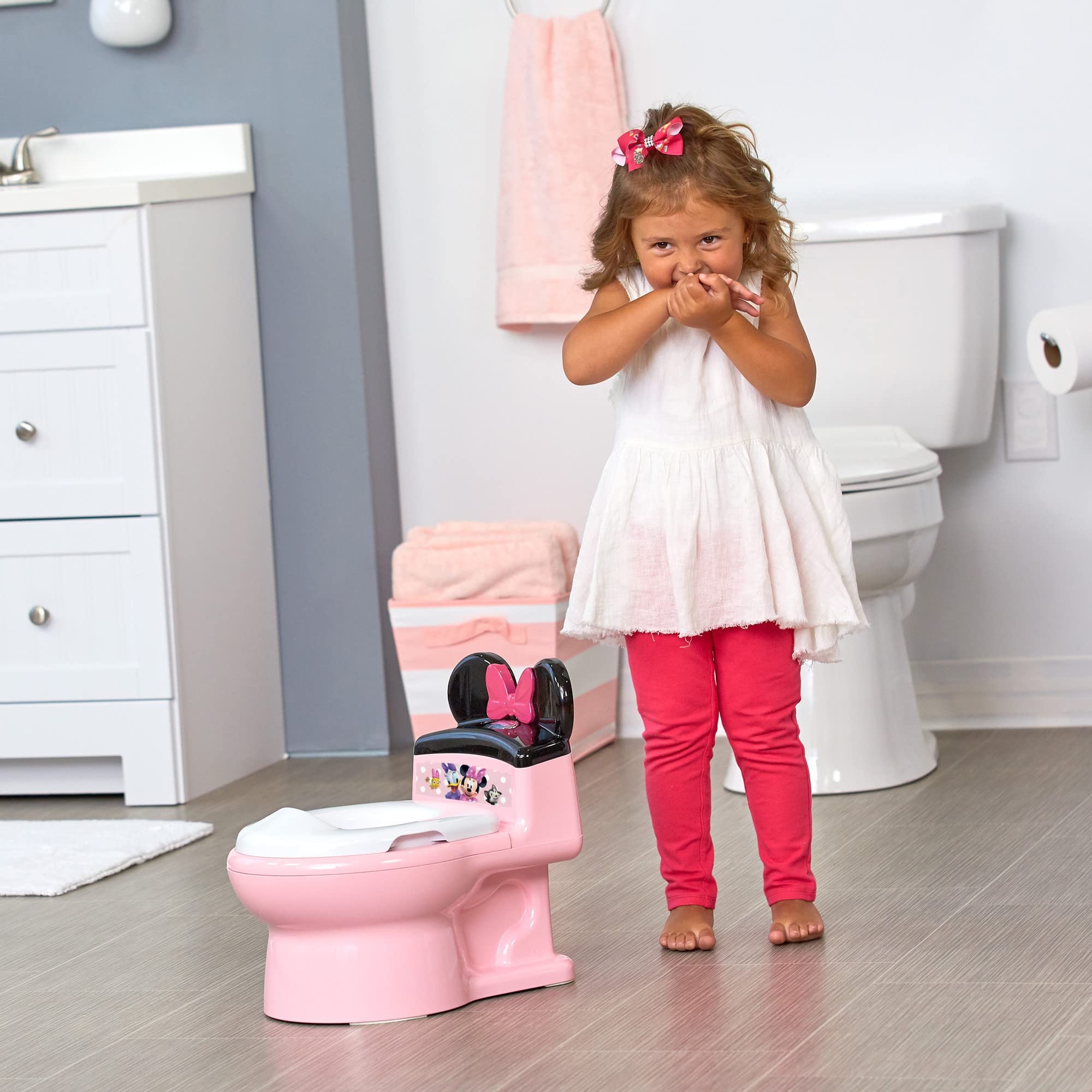 The First Years Disney Minnie Mouse Potty Training Toilet and Toddler Toilet Seat - Toilet Training Potty with Fun Flushing and Cheering Sounds,Pink