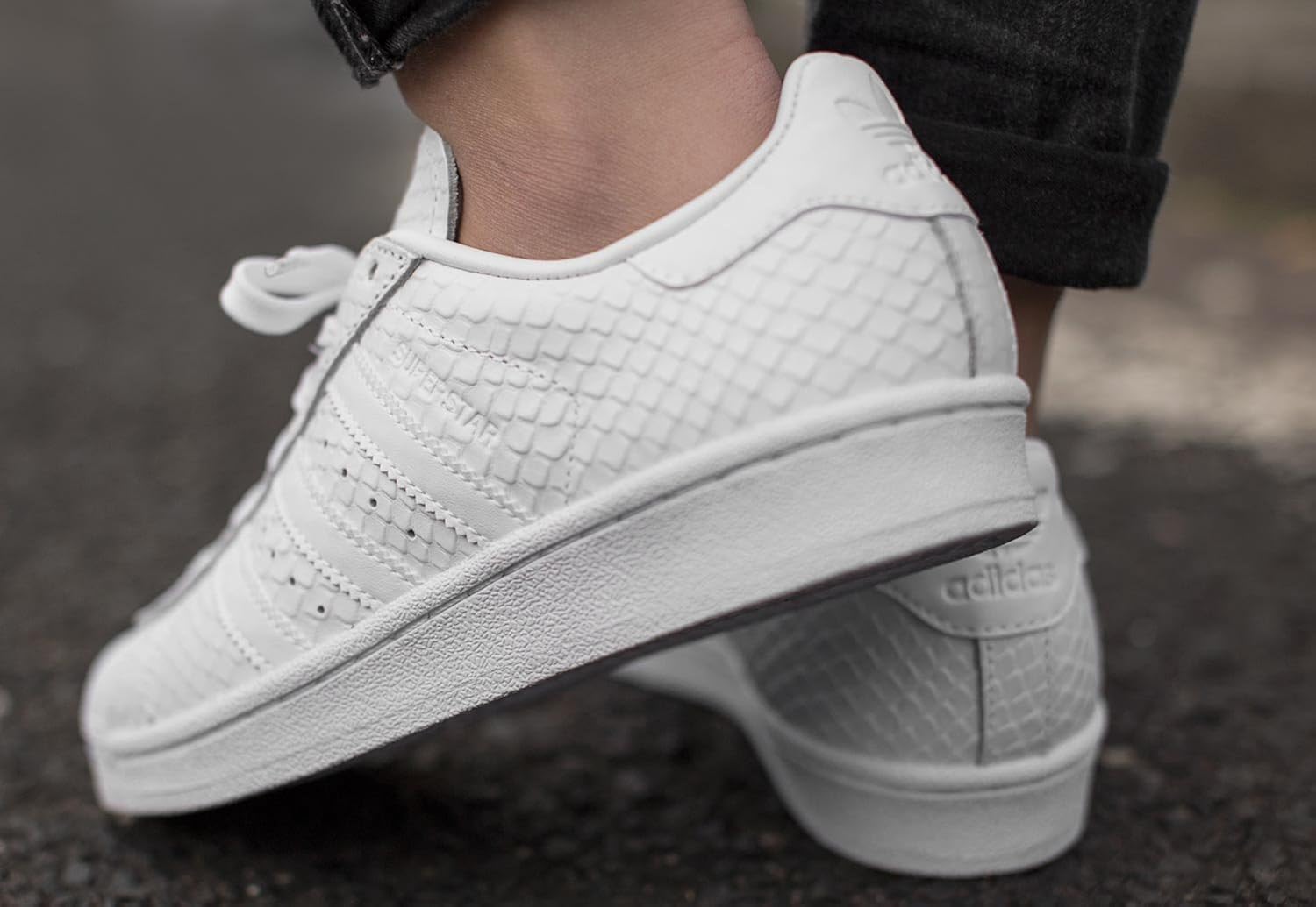 white adidas trainers with pink stripes