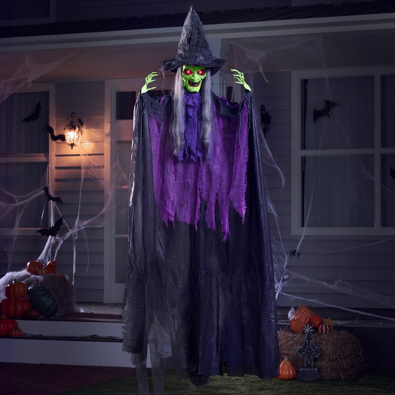 Photo 1 of JOYIN 72” Halloween Hanging Witch Decorations Outdoor, Flying Ghost Decor Green Face Life Size Sound Activated Light Up Eyes Party Supplies for Garden Haunted House Front Porch Door Scary Modern