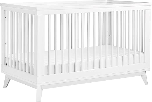 white and walnut crib