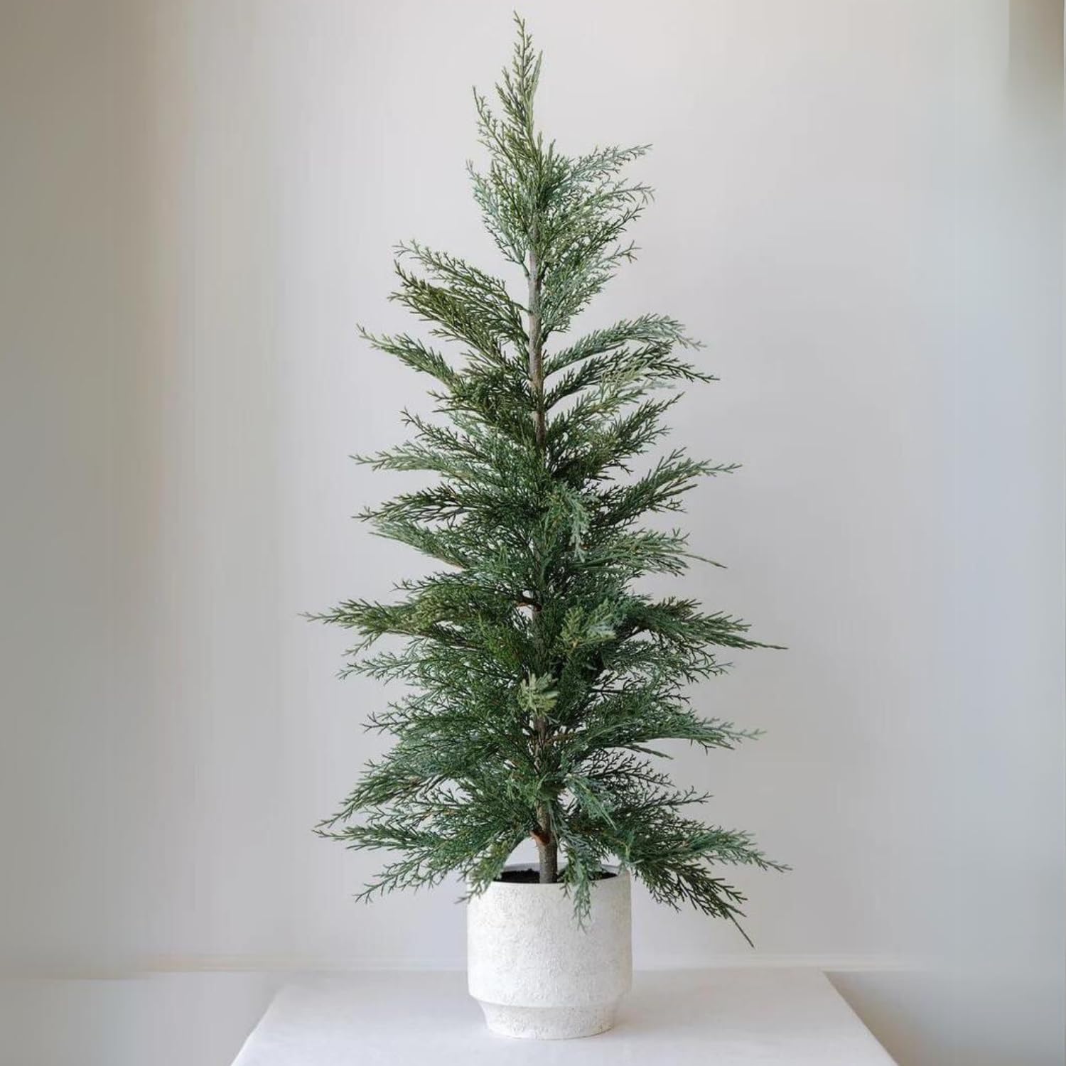 Photo 1 of CG Hunter Holiday Collection, Set-of-1 Faux Cedar Trees, Premium Artificial Indoor Cedar Tree Stands 36" Tall in Creme Pot–Perfect Christmas Decoration